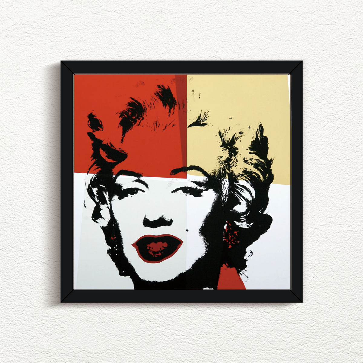 an image of a sunday b morning print after andy warhol titled 'golden marilyn 38' in black frame. the artwork features a black screenprint of marilyn monroe's face overlayed on a background of red, yellow, and white