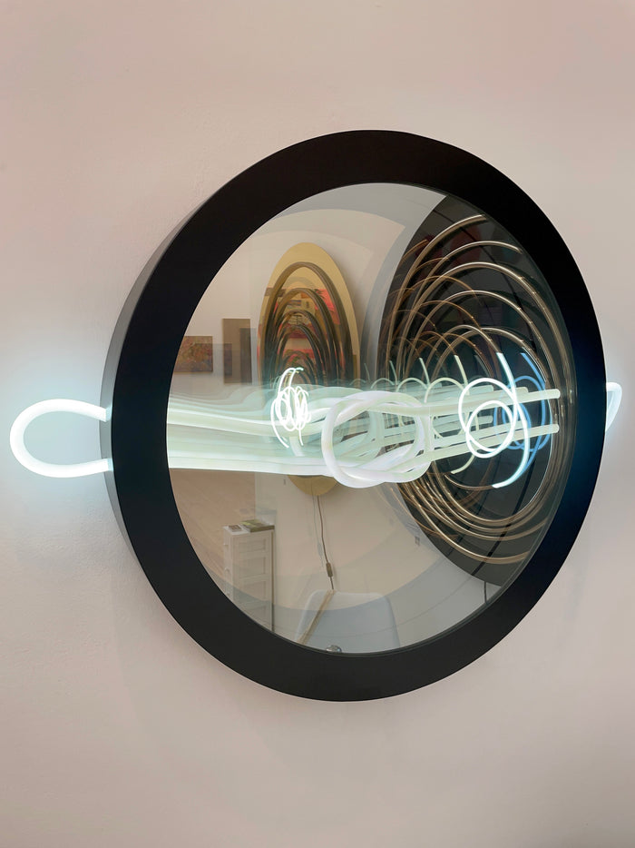 Mark Beattie's Infinity Love Knot – a luminous masterpiece blending LED light, two-way mirror, and aluminum frame (80 x 95 x 10 cm). Symbolizing eternal love, available in pink, red, and blue. Elevate your space with this captivating contemporary artwork.