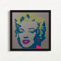 this is an image of a sunday b morning print after andy warhol titled 'marilyn 11:26' in a black frame. the artwork features a screenprint of marilyn monroe's face on a grey background with yellow hair and fuchsia lips with navy blue shadows. this is a sunday b morning print for sale.