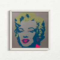 this is an image of a sunday b morning print after andy warhol titled 'marilyn 11:26' in a white frame. the artwork features a screenprint of marilyn monroe's face on a grey background with yellow hair and fuchsia lips with navy blue shadows. this is a sunday b morning print for sale.