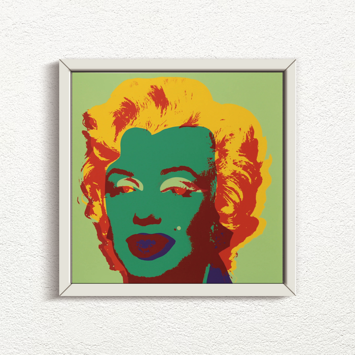 this is an image of a sunday b morning print after andy warhol titled 'marilyn 11:25' in a white frame. the artwork features a screenprint of marilyn monroe's face on a green background with bright yellow hair, green face, and red shadows. this is a sunday b morning print for sale