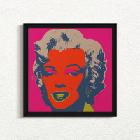 this is an image of a sunday b morning print after andy warhol, titled 'marilyn 11:22' in a black frame. the artwork features a screenprint of marilyn monroe's face in red, navy blue, yellow and beige on a hot pink background. this is a sunday b morning marilyn monroe print for sale