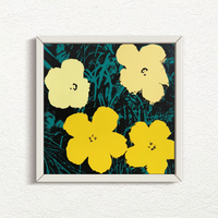 this is an image of an andy warhol artwork issued by sunday b morning titled 'flowers 11:72' in a white frame. the artwork features four yellow flowers screenprinted on a background of black and green grass. this is a sunday b morning print for sale