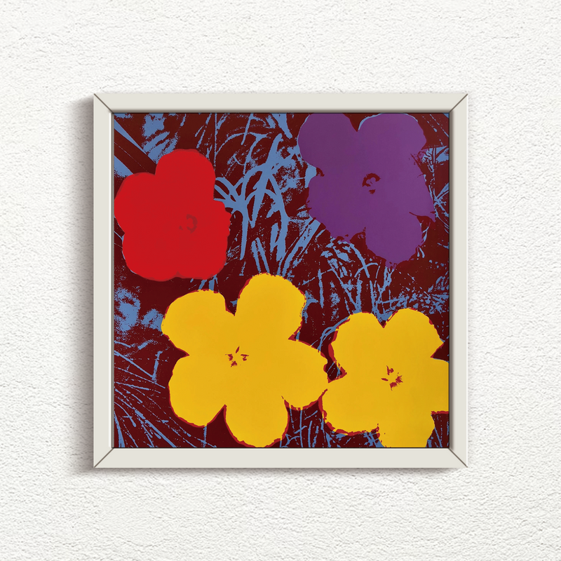 this is an image of a sunday b morning print after an andy warhol artwork titled 'flowers 11:71' in a white frame. the artwork features andy warhol's flowers ona grassy background. the background is blue and black, with red, blue, and yellow flowers superimposed. this is a sunday b morning print for sale