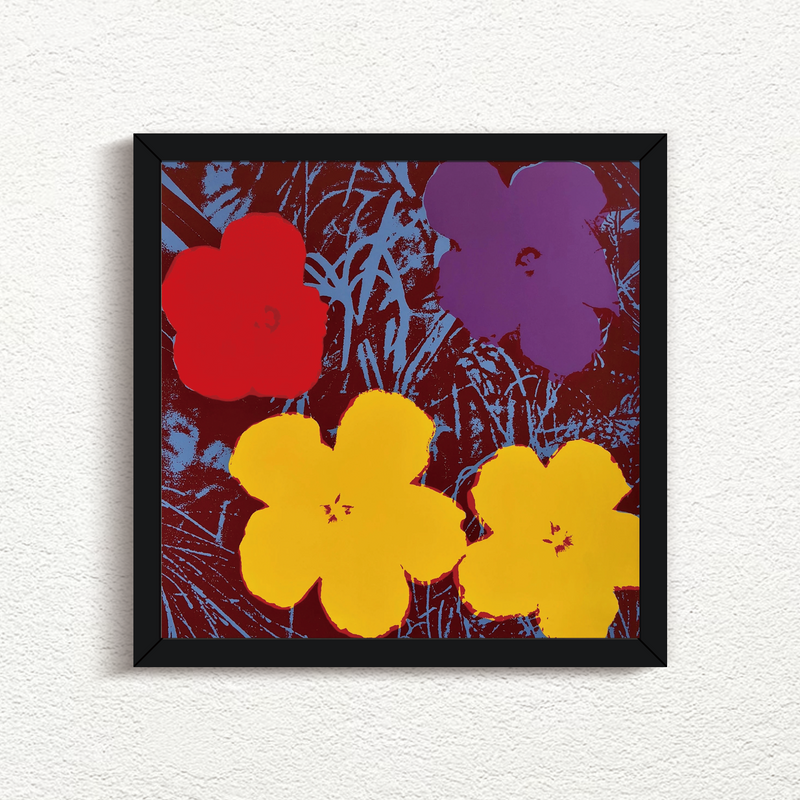 this is an image of a sunday b morning print after an andy warhol artwork titled 'flowers 11:71' in a black frame. the artwork features andy warhol's flowers ona grassy background. the background is blue and black, with red, blue, and yellow flowers superimposed. this is a sunday b morning print for sale