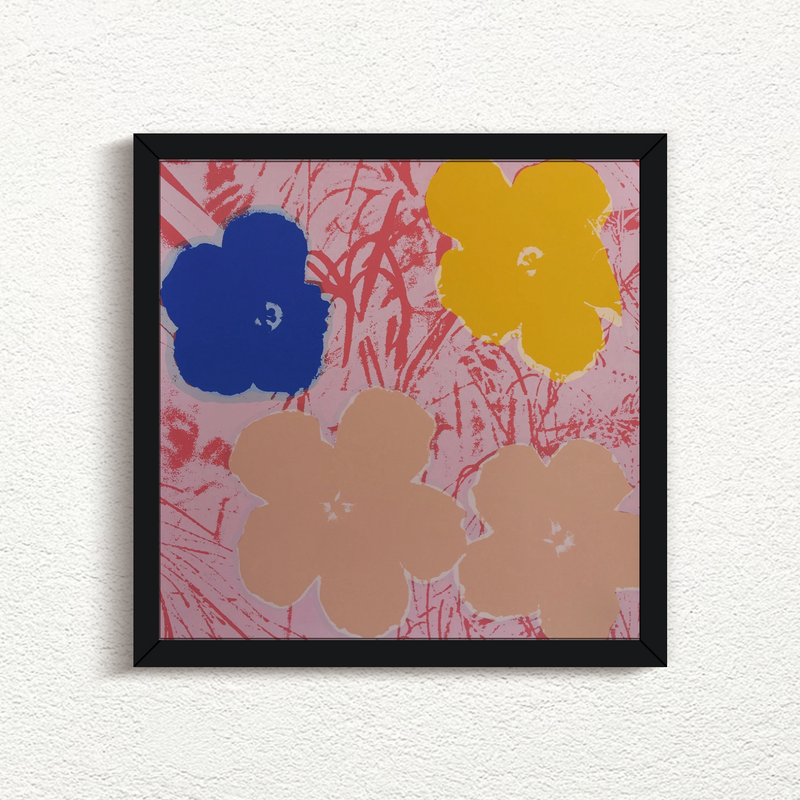 this is an image of a sunday b morning print after the andy warhol artwork 'flowers 11:70' in a black frame. the artwork features a pink grassy background and four flowers, in blue, yellow, and cream colours. this is a sunday b morning print for sale