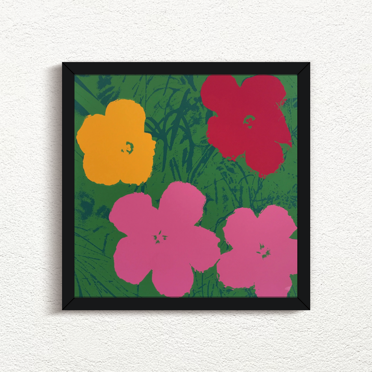 image of a sunday b morning print after andy warhol titled 'flowers 11:68' in a black frame. the artwork is the famous andy warhol flowers in a green, red, yellow, and pink colourway. this is a sunday b morning print