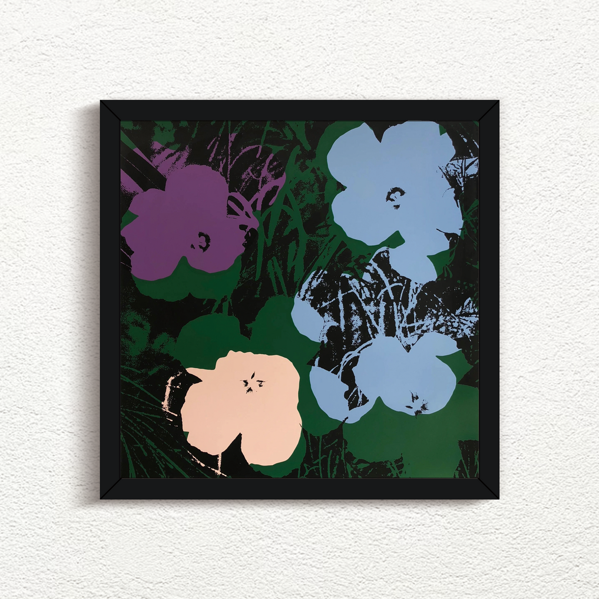 an artwork by andy warhol titled 'flowers 11:64' in a black frame, printed by sunday b morning. the artwork features four flowers on a green and black background, with the four flowers being purple, blue, and cream in colour. this is a sunday b morning print for sale