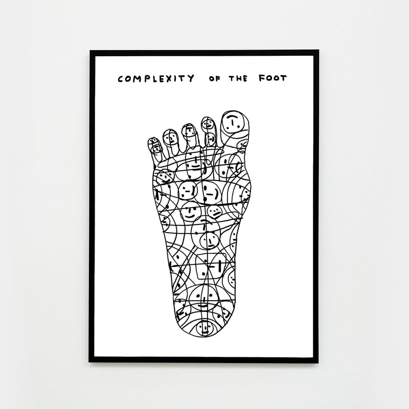 a photo of a framed art print by david shrigley, depicting a foot made out of doodled smiley faces and swirls, and text at the top of the page stating 'COMPLEXITY OF THE FOOT'. buy david shrigley prints, david shrigley art, david shrigley prints, david shrigley art prints, david shrigley for sale uk, david shrigley posters, shrigley posters, shrigley prints