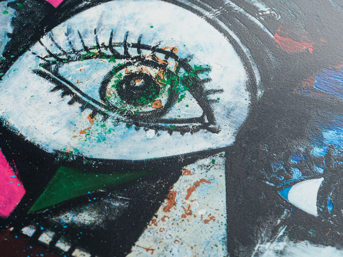 Close up image of the eye on a George Condo print 