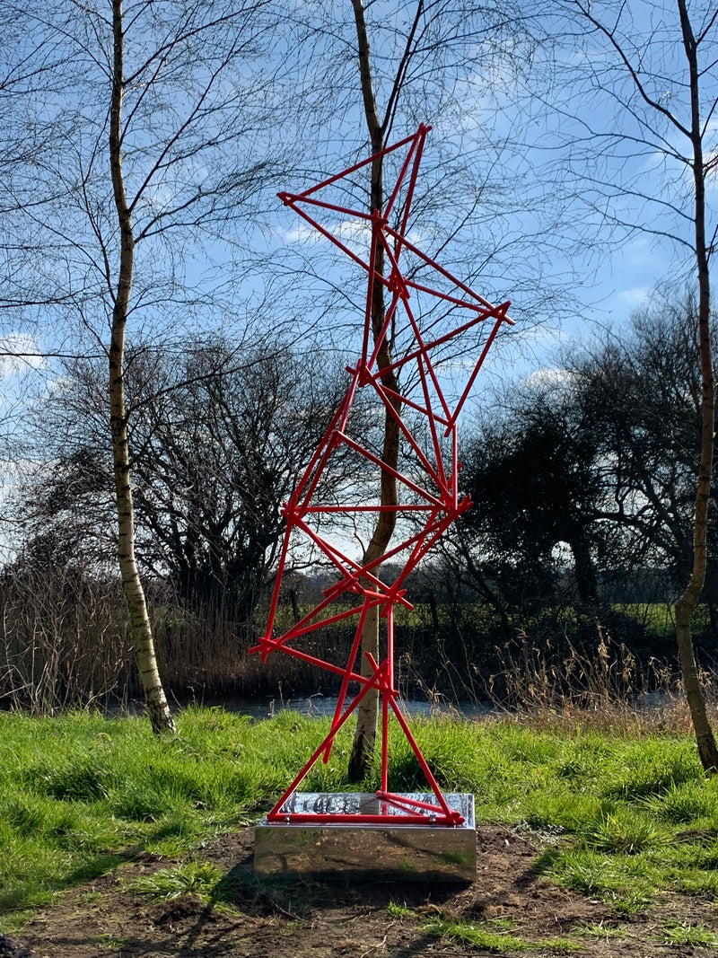 a unique blend of painted copper & LED rope light on a mirror-polished stainless steel plinth