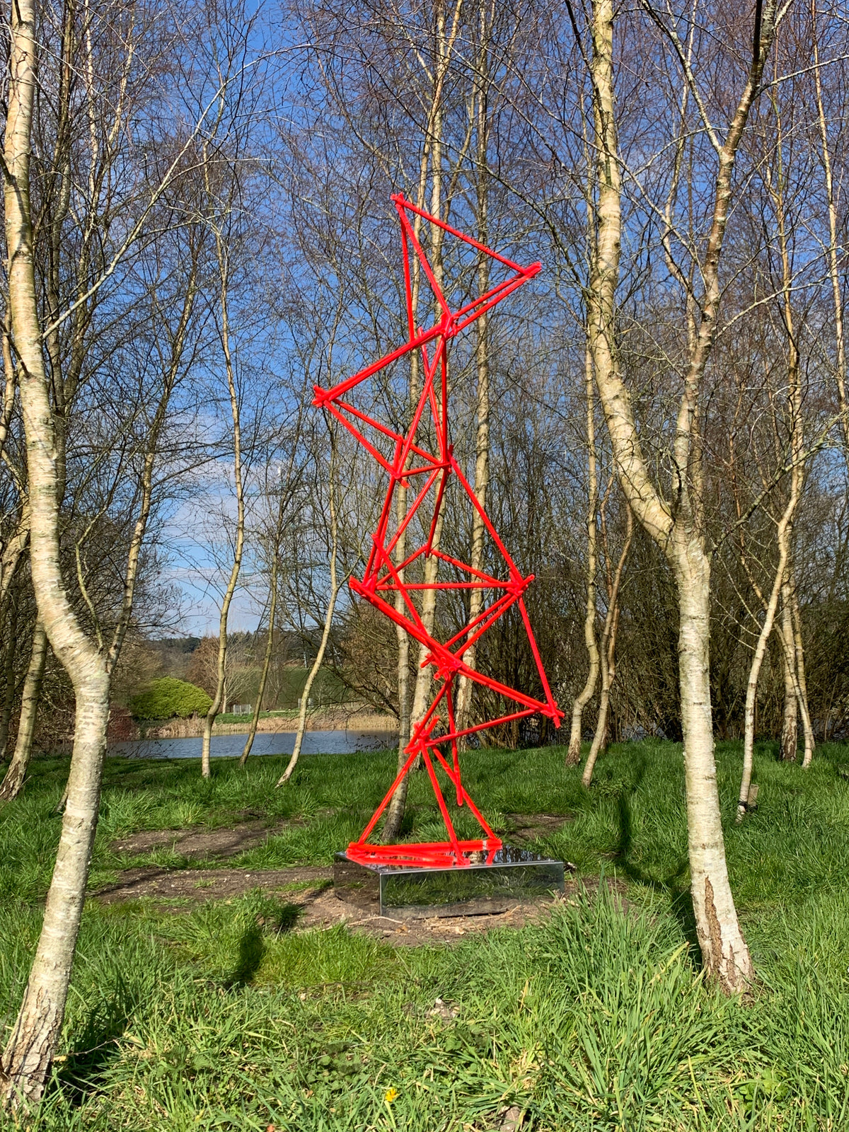 a unique blend of painted copper & LED rope light on a mirror-polished stainless steel plinth