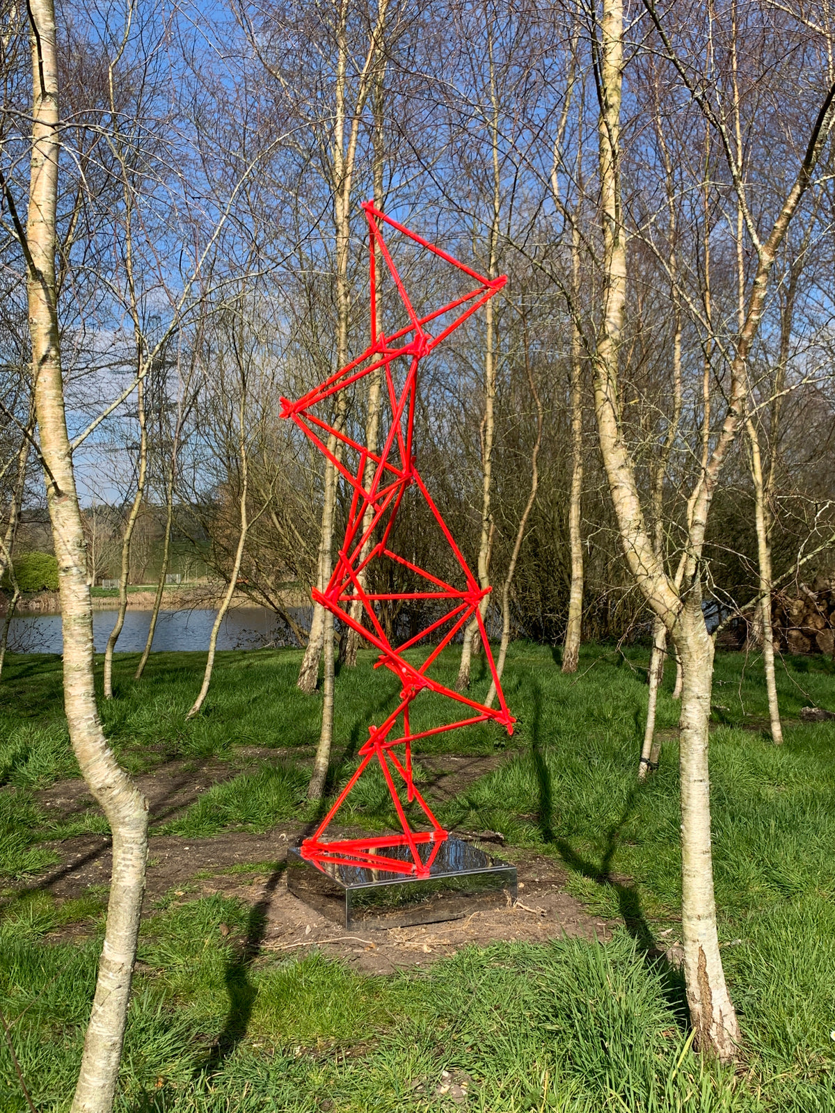 a unique blend of painted copper & LED rope light on a mirror-polished stainless steel plinth