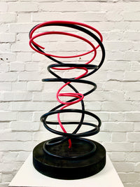 Introducing Mark Beattie's Pink in Black Spiral, a truly unique sculpture crafted from painted copper on a burnt plinth. This one-of-a-kind masterpiece stands at 65 x 40 x 45cm, showcasing the captivating fusion of colors and textures. Elevate your space with the artistic brilliance of Pink in Black Spiral, where creativity meets individuality in a stunning display of contemporary art.