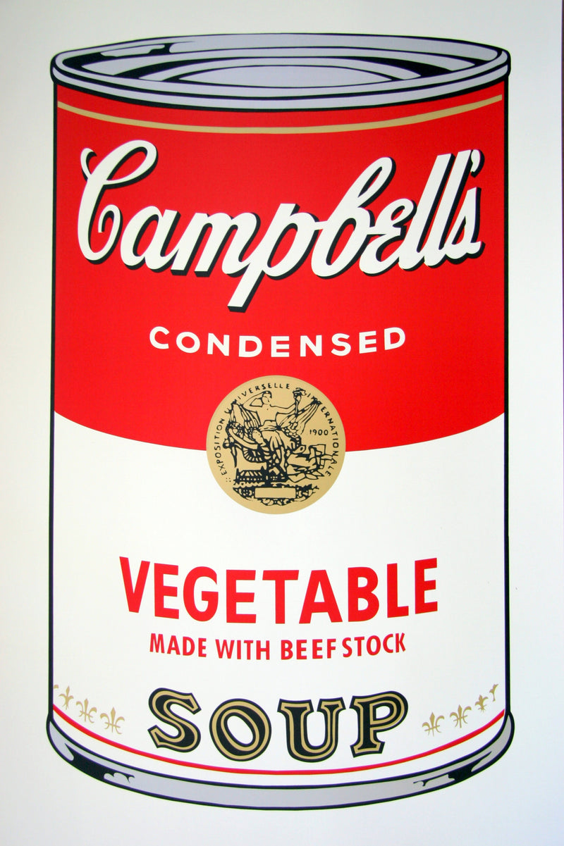 image of artwork by andy warhol titled 'campbells vegetable soup'. The image features a large, cartoon-like, art pop depiction of a soup tin, printed in red, gold, grey, white, and black colours. the tin reads 'campbells condensed vegetable made with beef stock soup'. this is a sunday b morning print