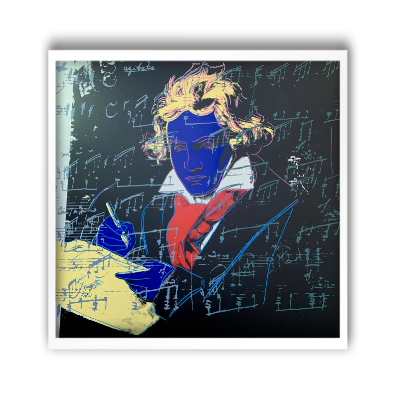 an image of an andy warhol artwork titled 'beethoven 390' in a white frame. the image features beethoven colourised with a royal blue face, yellow hair and writing equipment, and a red scarf. the background is black, and there is an overlay of blue musical notation. this is a sunday b morning print