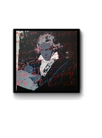 an image of an andy warhol artwork titled 'beethoven 391' in a black frame. the artwork features an image of beethoven in the centre, colourised with grey skin, hair, and writing equipment. his shirt is white, with a grey scarf and black jacket. the background is mostly black, excepting a small white section on the left. there is an overlay of red musical notation. this is a sunday b morning print