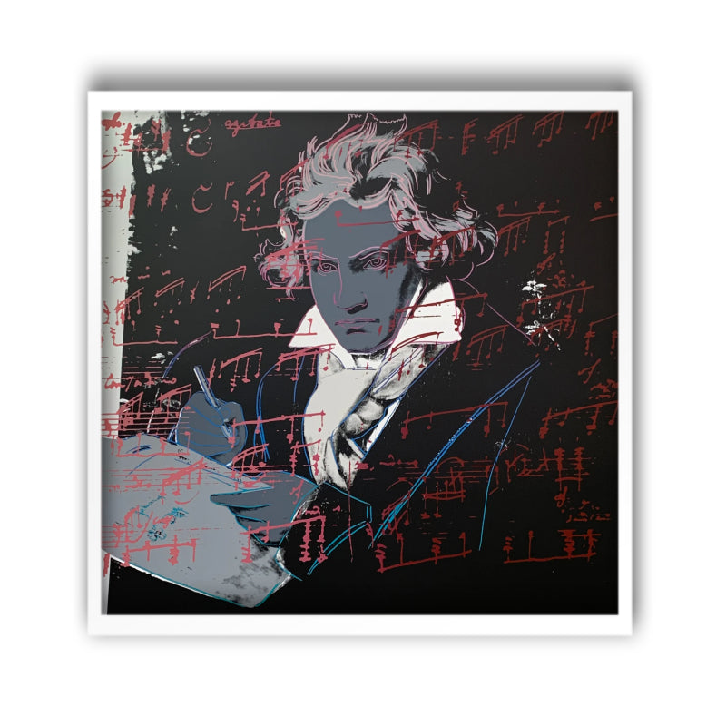 an image of an andy warhol artwork titled 'beethoven 391' in a white frame. the artwork features an image of beethoven in the centre, colourised with grey skin, hair, and writing equipment. his shirt is white, with a grey scarf and black jacket. the background is mostly black, excepting a small white section on the left. there is an overlay of red musical notation. this is a sunday b morning print