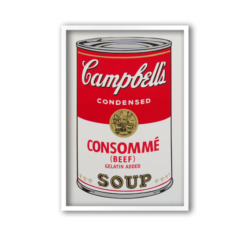 an image of andy warhol's artwork 'campbell's consomme soup' in a white frame. the image features a cartoon-like, pop art depiction of a can of soup, with red, grey and gold colours. the tin reads 'campbell's condensed consomme (beef) gelatin added soup'. this is a sunday b morning print