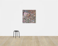 image of artwork hung on plain background. abstract artwork featuring many colourful paint splodges on a grey background