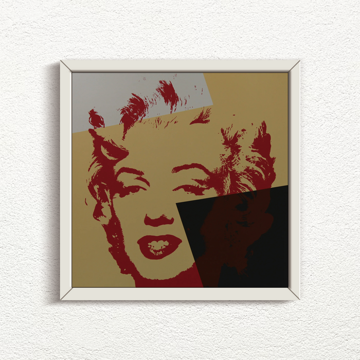 an image of an artwork by andy warhol titled 'golden marilyn 44' in white frame. the artwork features a stencilled print of the face of marilyn monroe, printed in red over a background of gold, black, and white. this is a sunday b morning print for sale.