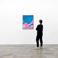 this is an image of a david shrigley artwork titled 'weather forecast' in a black frame on a white wall with a single spectator to its right. the artwork features paper cutouts of a pink cloud, blue streams, blue clouds, and a blue ocean. these are all overlayed onto one another, with handwritten text in the bottom right corner stating 'WEATHER FORECAST'. this is a david shrigley poster for sale