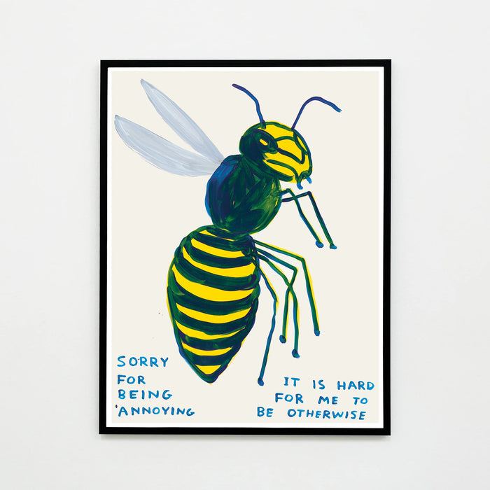 This is an image of an artwork by david shrigley titled 'sorry for being annoying', in a black frame. the artwork features a large image of a wasp with the handwritten text 'sorry for being annoying it is hard for me to be otherwise'. this is a david shrigley print for sale