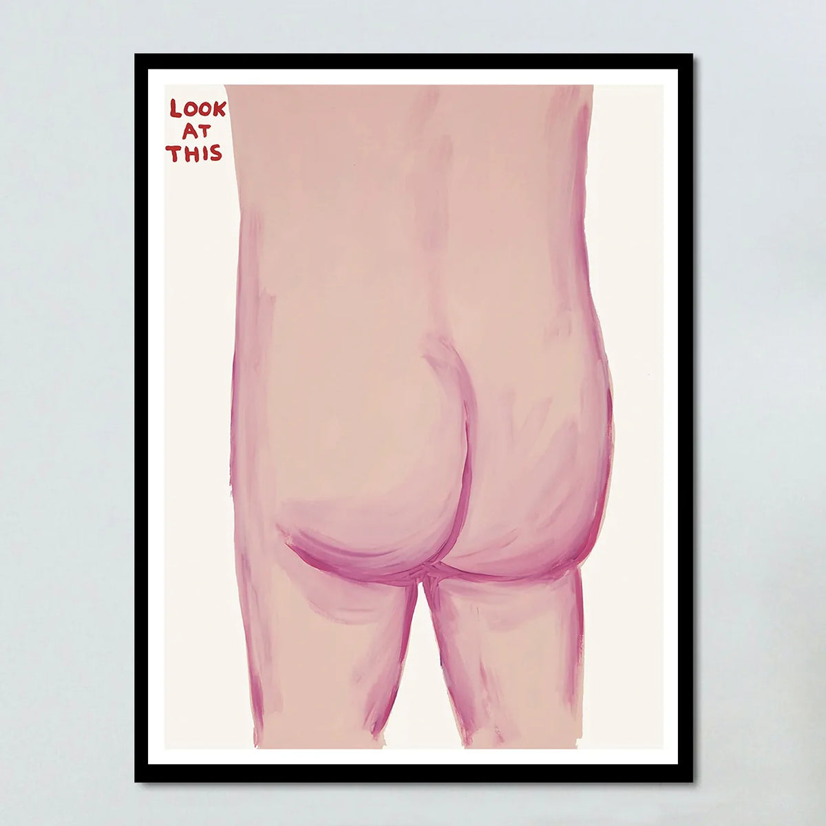 Image of an artwork by David Shrigley titled 'Look at This' in a black frame. The piece features the bare bottom of someone, with the tagline 'look at this' in the top left. this is a david shrigley poster and a david shrigley print