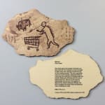 This artwork by Banksk titled Peckham Rock contain a cave painting of a human pushing a shopping trolley whilst huniting a boar which has two arrows in it providing satirical humour which contatind images of the reverse of the artwork 